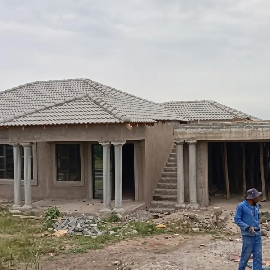 Completed residential home with tiled roof and exterior finishes